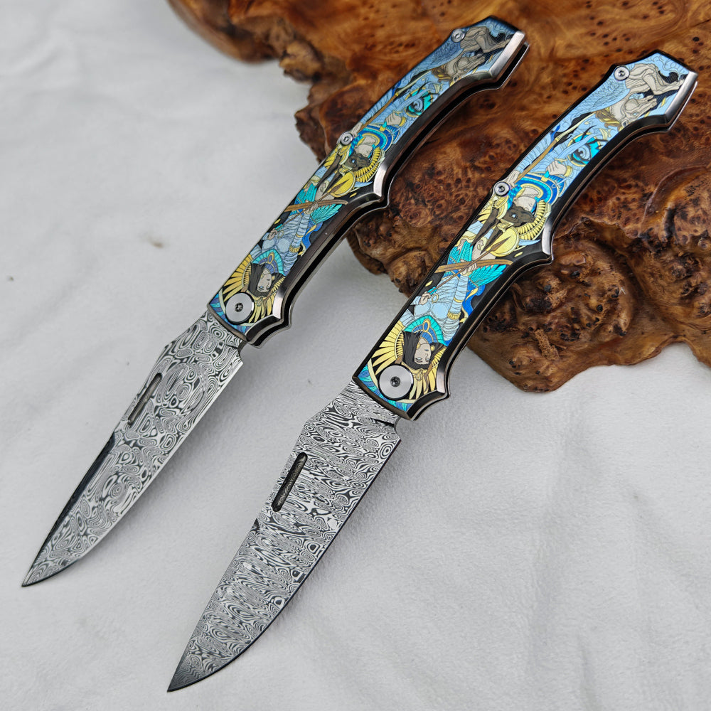 Anubis Pocket Knife Titanium 3D Coloured Sculpting - Damasteel