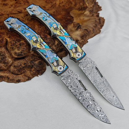 Anubis Pocket Knife Titanium 3D Coloured Sculpting - Damasteel