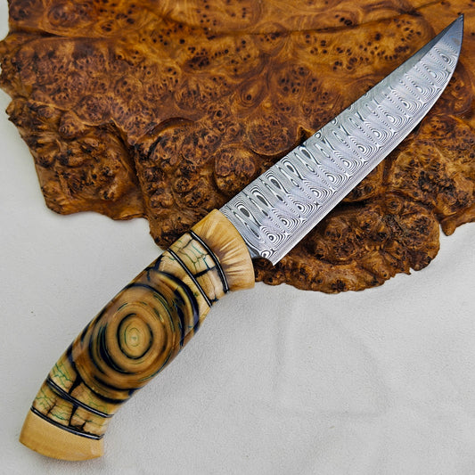 Hunter in Damasteel with Mammoth Tusks