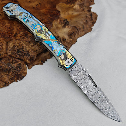 Anubis Pocket Knife Titanium 3D Coloured Sculpting - Damasteel