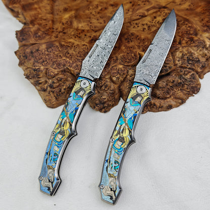 Anubis Pocket Knife Titanium 3D Coloured Sculpting - Damasteel